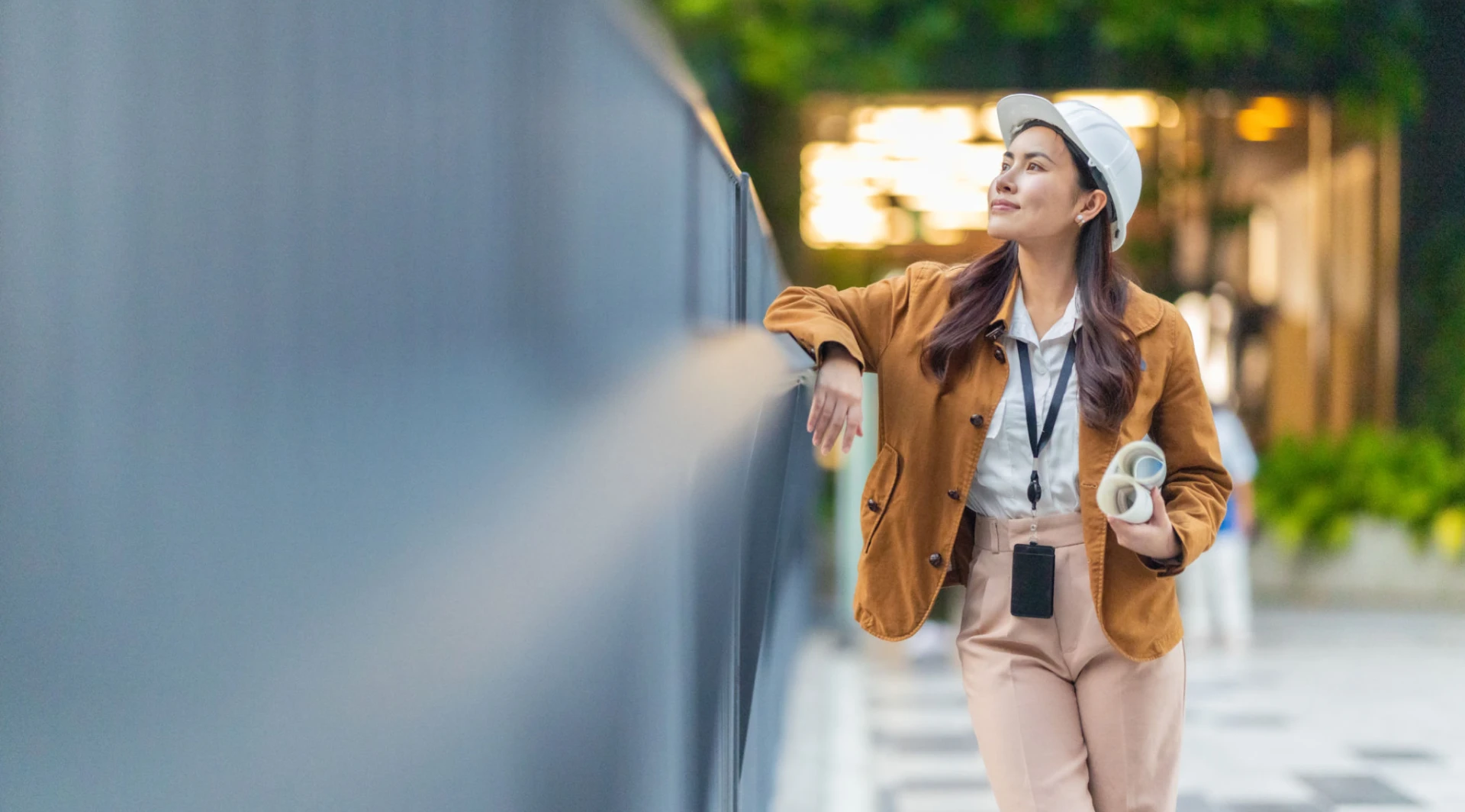 Relaxed woman leaning on a railing